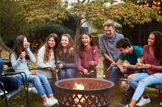 Church group gathering around a fire wearing their Church Event Wristbands